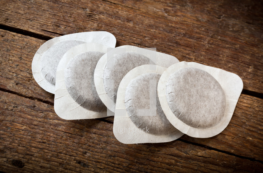 coffee pods on a wood background 