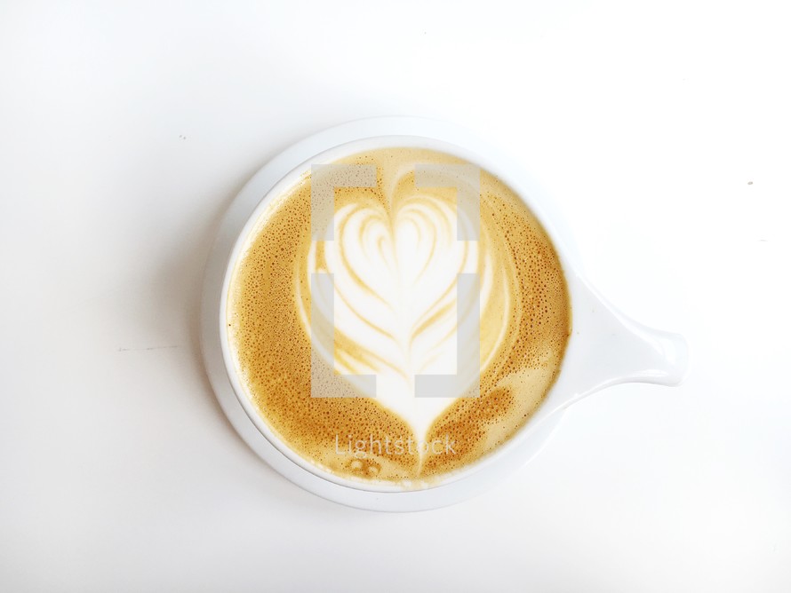 heart shape creamer in a latte