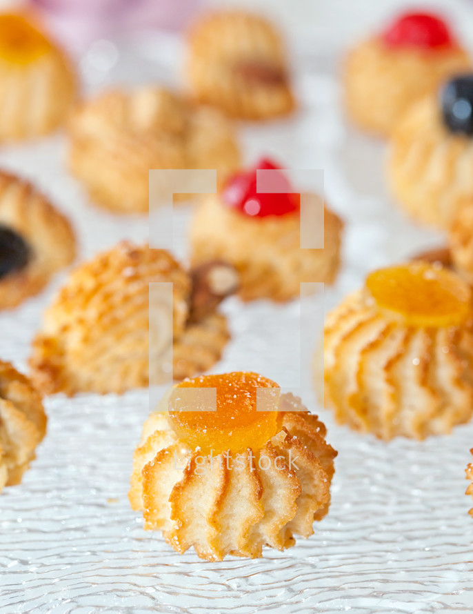 Almond pastries decorated with orange candies