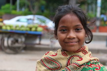 Lower caste Hindu girl in local vegetable market (Try also search for ethnic smile)