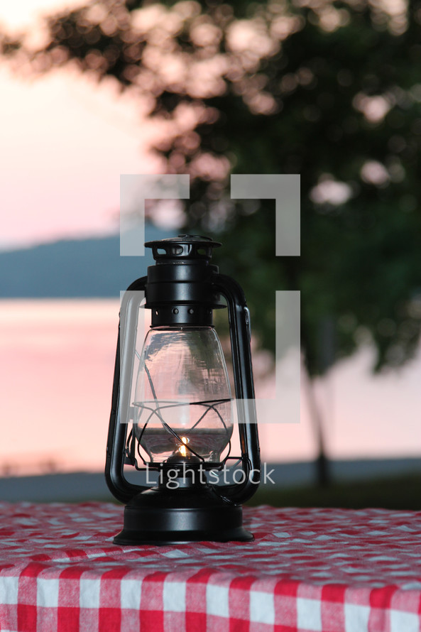 lantern on a picnic table 