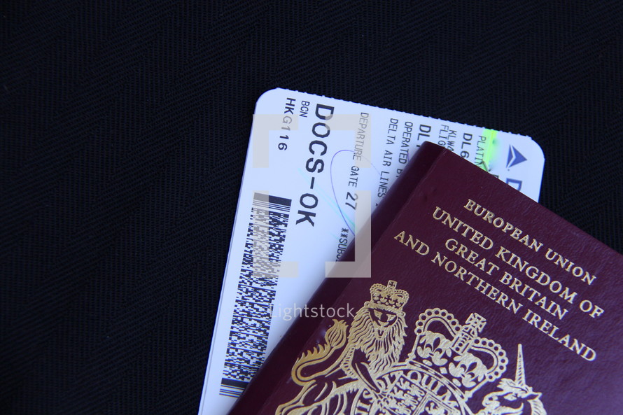 Plane ticket and british UK passport 