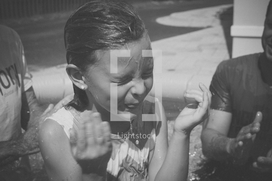 A little girl who has just been baptized.