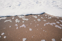 sea foam on a beach 