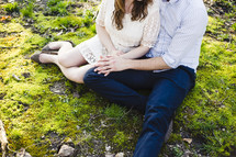 couple sitting on the ground 