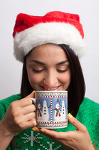 woman drinking hot cocoa at Christmas 