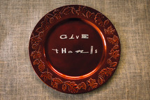words give thanks on a brown fall plate 