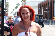 woman with red hair, tattoos, and, necklaces 