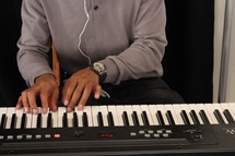 a man playing a keyboard 