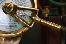 Brass ship's telegraph set on full speed ahead