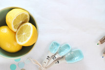 bowl of lemons, dots, measuring spoons, kitchen, cooking, pencils 