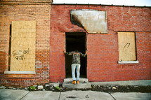 a person looking into an abandoned building 
