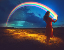 A woman reading a Bible with bright glowing rainbow coming from the pages - God's promises are true.