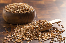 Bowl of Spelt Grain on a Wooden Butchers Block