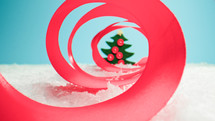 Christmas tree decoration inside a ribbon spiral 