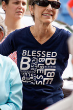 a woman wearing a blessed t-shirt 