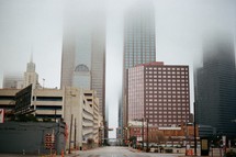 fog over city skyscrapers 