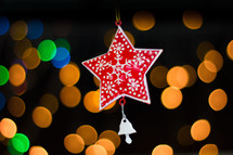 hanging star ornament and bokeh Christmas lights 