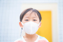 a child wearing a face mask 