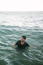 a man swimming in the ocean 
