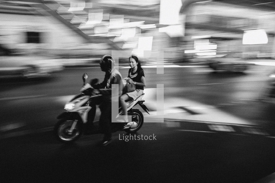 man and woman on a motorcycle in Thailand 