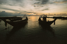 Boats anchored in a harbor in THailand. 