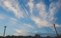 wispy clouds in a blue sky