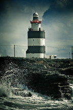 lighthouse and waves on a coast 