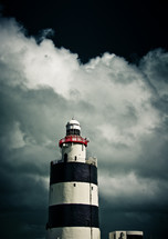 black and white lighthouse and storm clouds 