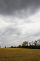 rain clouds over a field 
