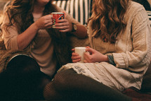 women in conversation drinking hot cocoa 