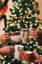 toasting with mugs of hot cocoa 