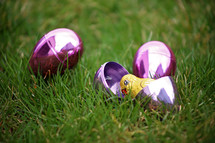 candy in plastic Easter eggs in the grass 