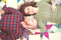 couple lying on a blanket 