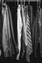 Men's shirts hanging in a closet.