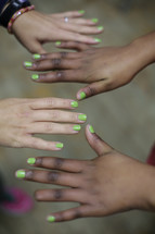 Hands with bright nail polish
