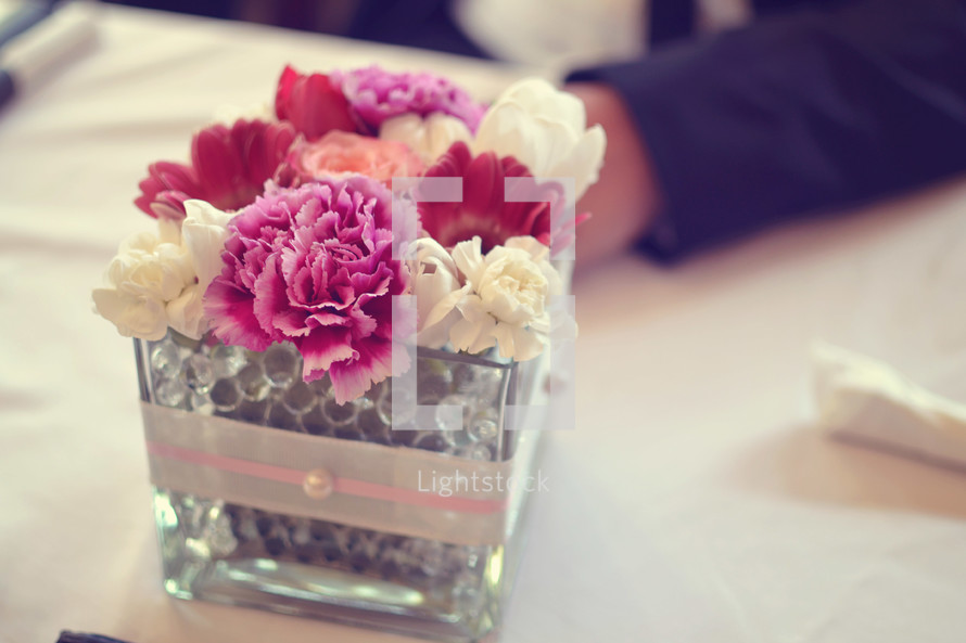 carnation flower arrangement at the center of a table 