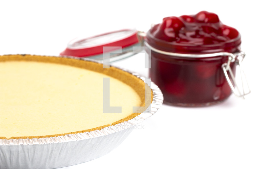 Thick Cherry Pie Filling in a Glass Canning Jar and cheese cake 