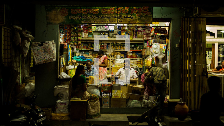 vendors at a street market at night 