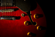 saddle and knobs on an electric guitar
