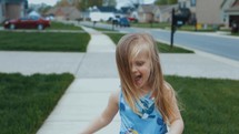 child running down a sidewalk 