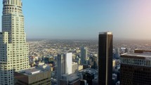 Aerial view of the Financial District in Downtown Los Angeles. Passing by Huge Office Building Skyscraper Rooftops in Downtown Los Angeles.