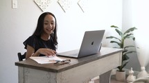 a woman working from home on a video conference 