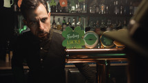 Barman Serves Mug Of Green Beer
