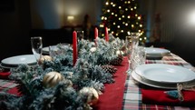 Set Christmas table for family dinner