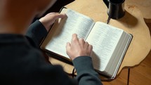 young man reading a Bible 