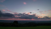 Clouds sky over countryside nature in summer morning sunrise time lapse
