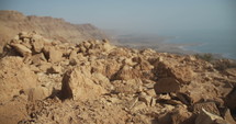Tracking shot of rocky landscape above the Dead sea in Israel.