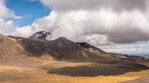 Beautiful sunny summer day with dramatic grey clouds sky over volcano mountains nature in New Zealand Time-lapse
