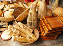 Different types of bamboo, wooden and thatched baskets and containers